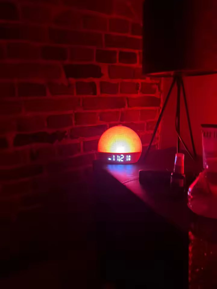 Lumipad light on a table with a brick wall background
