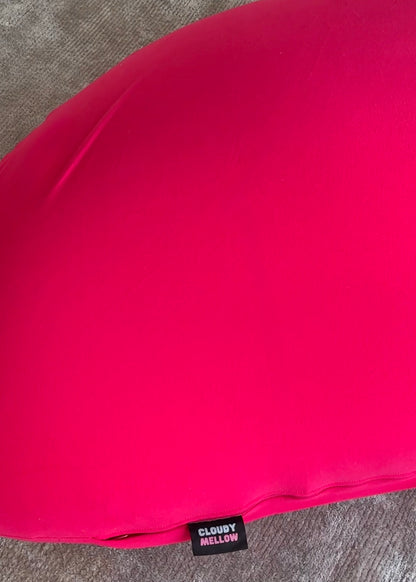 Red fabric with a 'Cloudy Mellow' label on a gray surface