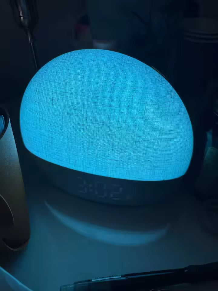 Blue textured smart speaker on a dark surface