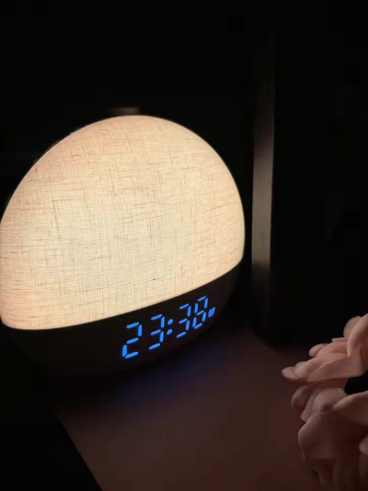 Textured round night light with digital display showing time in a dark setting